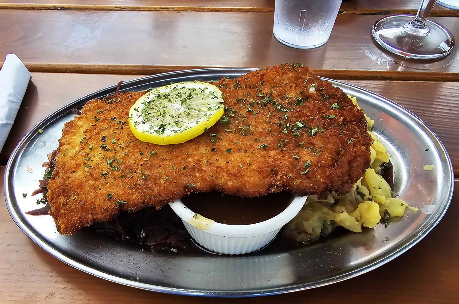 Pork schnitzel with potato salad and red cabbage at Urban German Wursthaus in St Johns