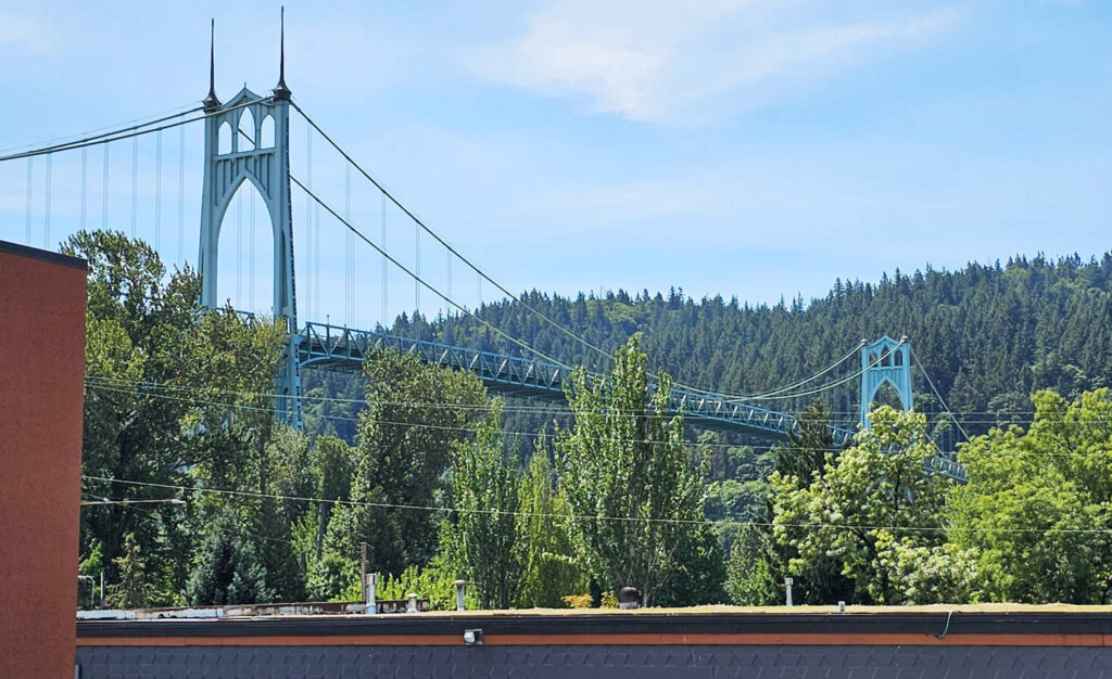 The St Johns Bridge, photographed from the outdoor dining area at Urban German restaurant in St Johns in Portland, Oregon
